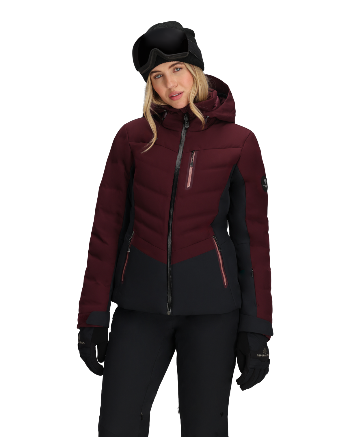 Person wearing a maroon and black ski jacket with goggles on a white background